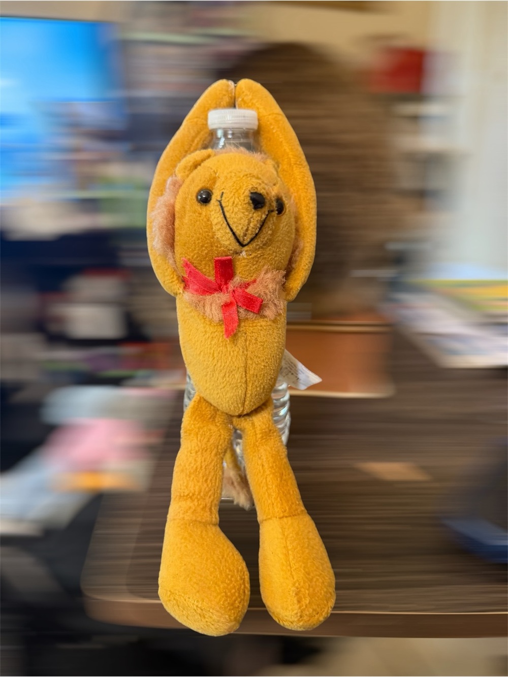 Yellow Plush Bear Bottle Holder with Red Bow Accent